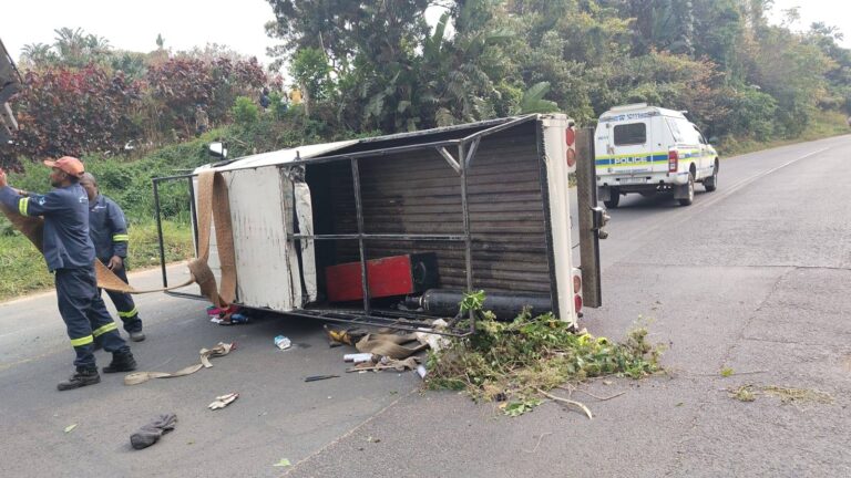 Emergency responders at the scene of a vehicle rollover blocking the road in Melville