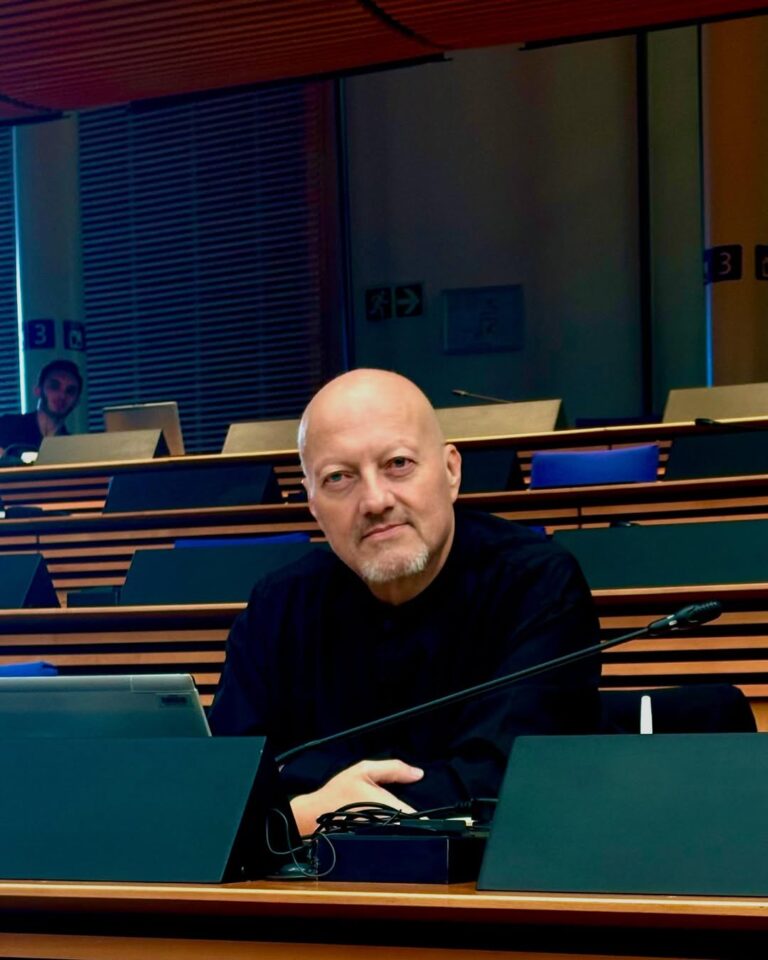 Portrait of Neil de Beer, former security adviser to Nelson Mandela and founder of the United Independent Movement, smiling at a public event