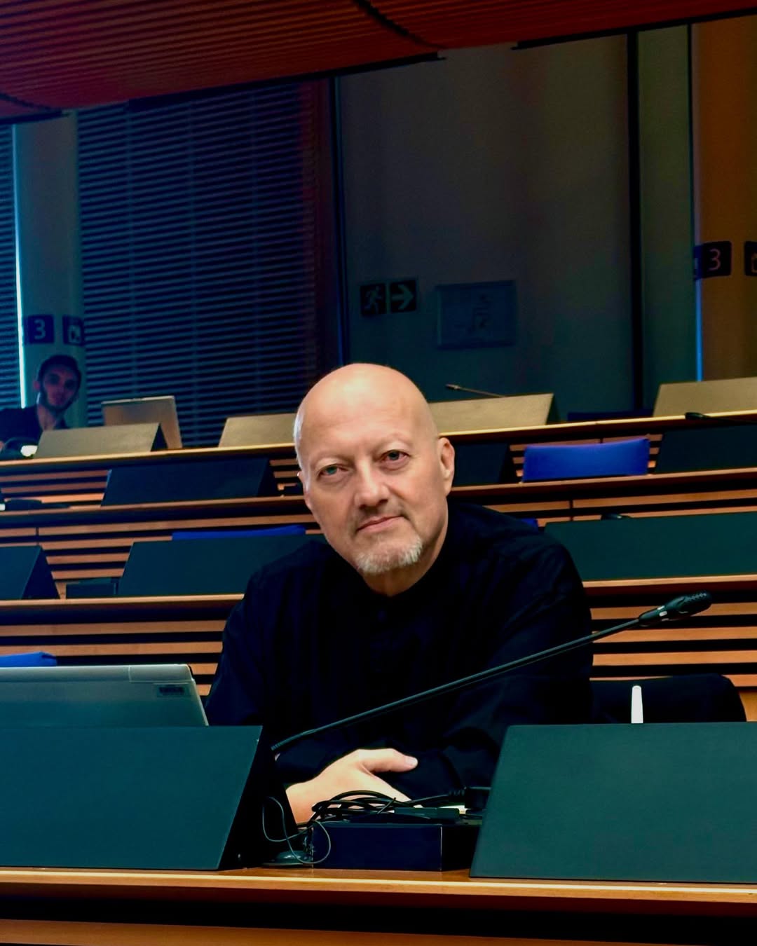 Portrait of Neil de Beer, former security adviser to Nelson Mandela and founder of the United Independent Movement, smiling at a public event