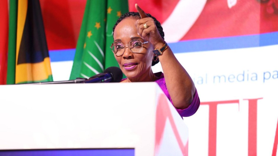 A formal photo of Minister Sindisiwe Chikunga at a podium