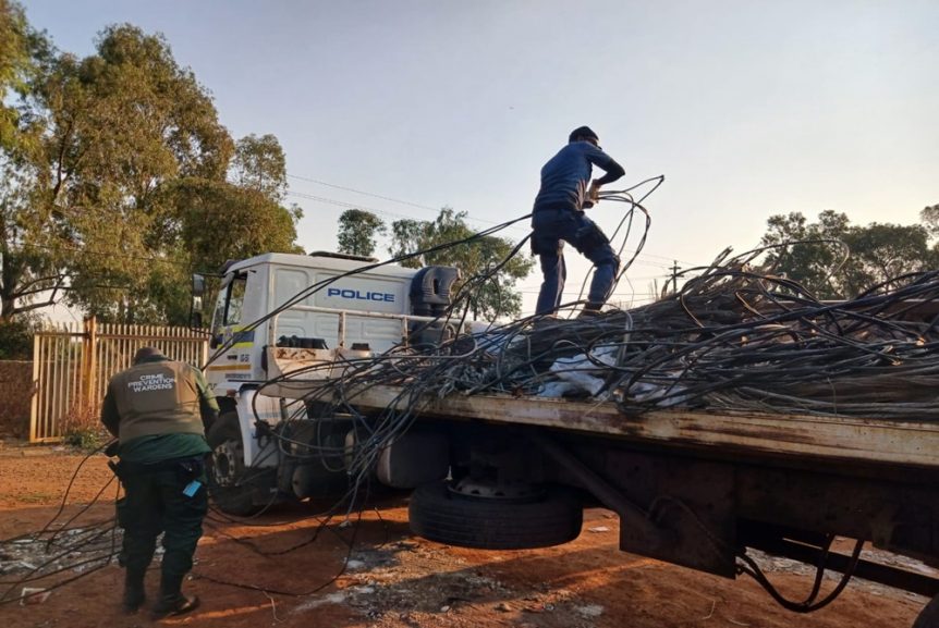 Police and Transnet security at a scrapyard with seized copper cable during an anti-theft operation in Gauteng.