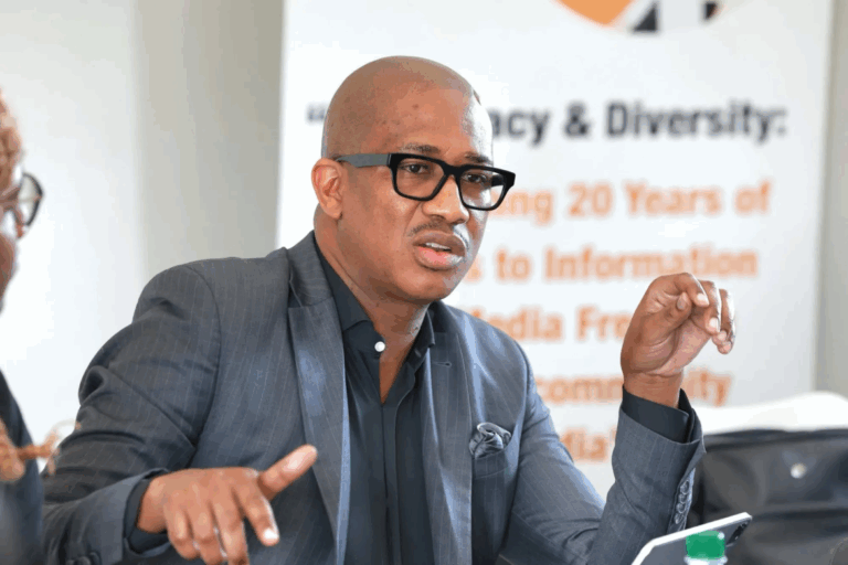 A photo of Deputy Minister Kenny Morolong addressing the audience at a podium, or a group of public servants engaging in a workshop during IPSM.