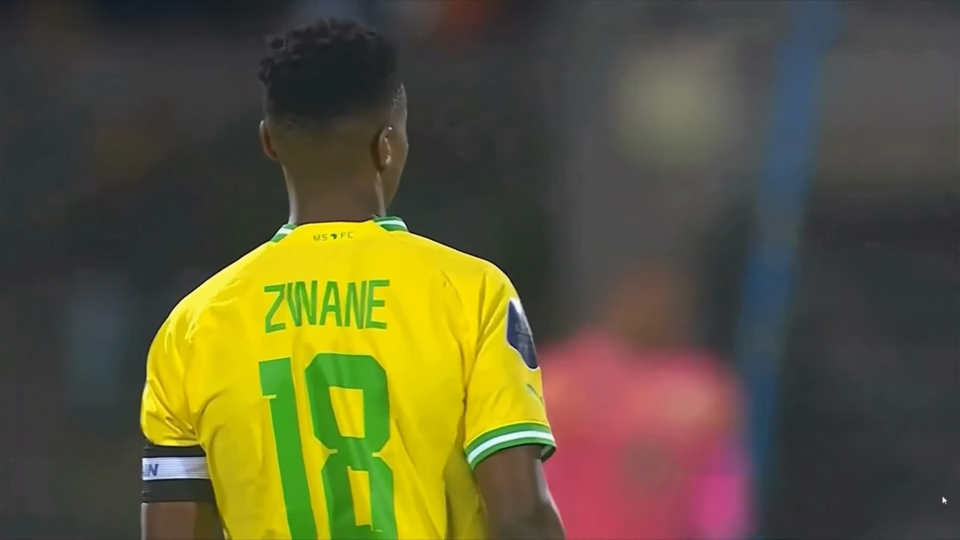 Themba Zwane limping off pitch during Sundowns vs Magesi after injury substitution.