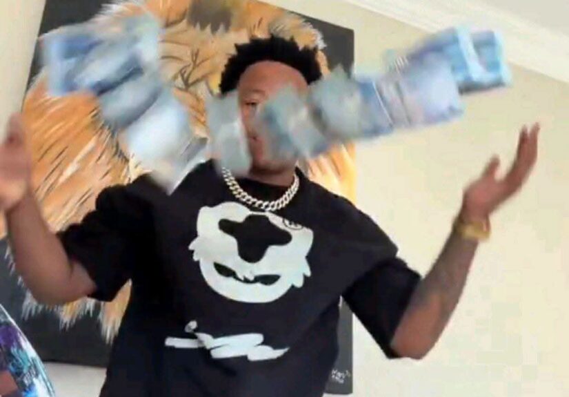 South African YouTuber Ghost hlubi showing off stack of cash