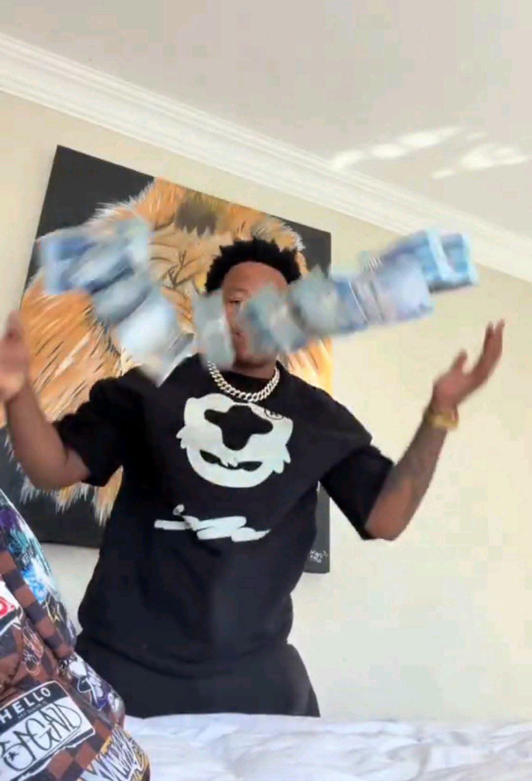 South African YouTuber Ghost hlubi showing off stack of cash